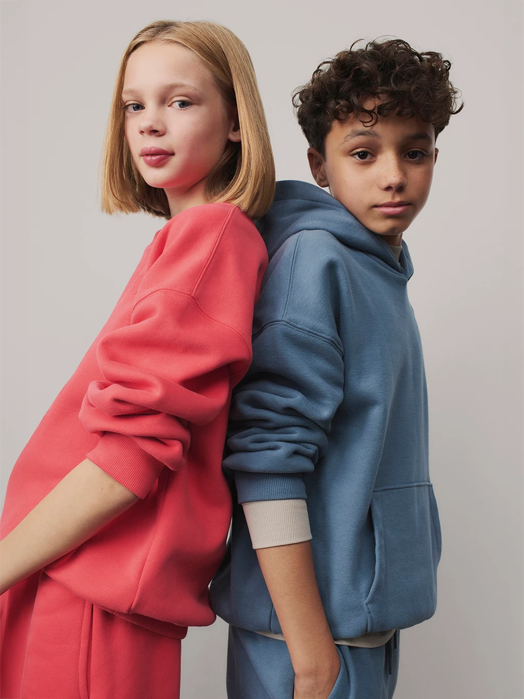 Girl and boy wearing colourful matching loungewear sets
