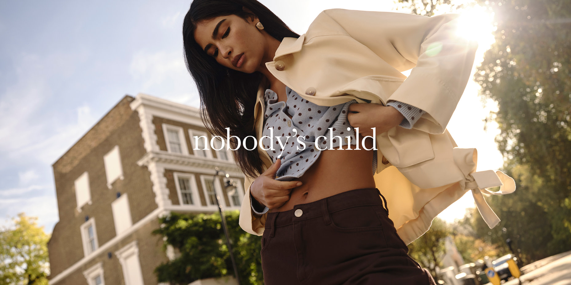 Woman wearing Nobody's Child jacket and blouse