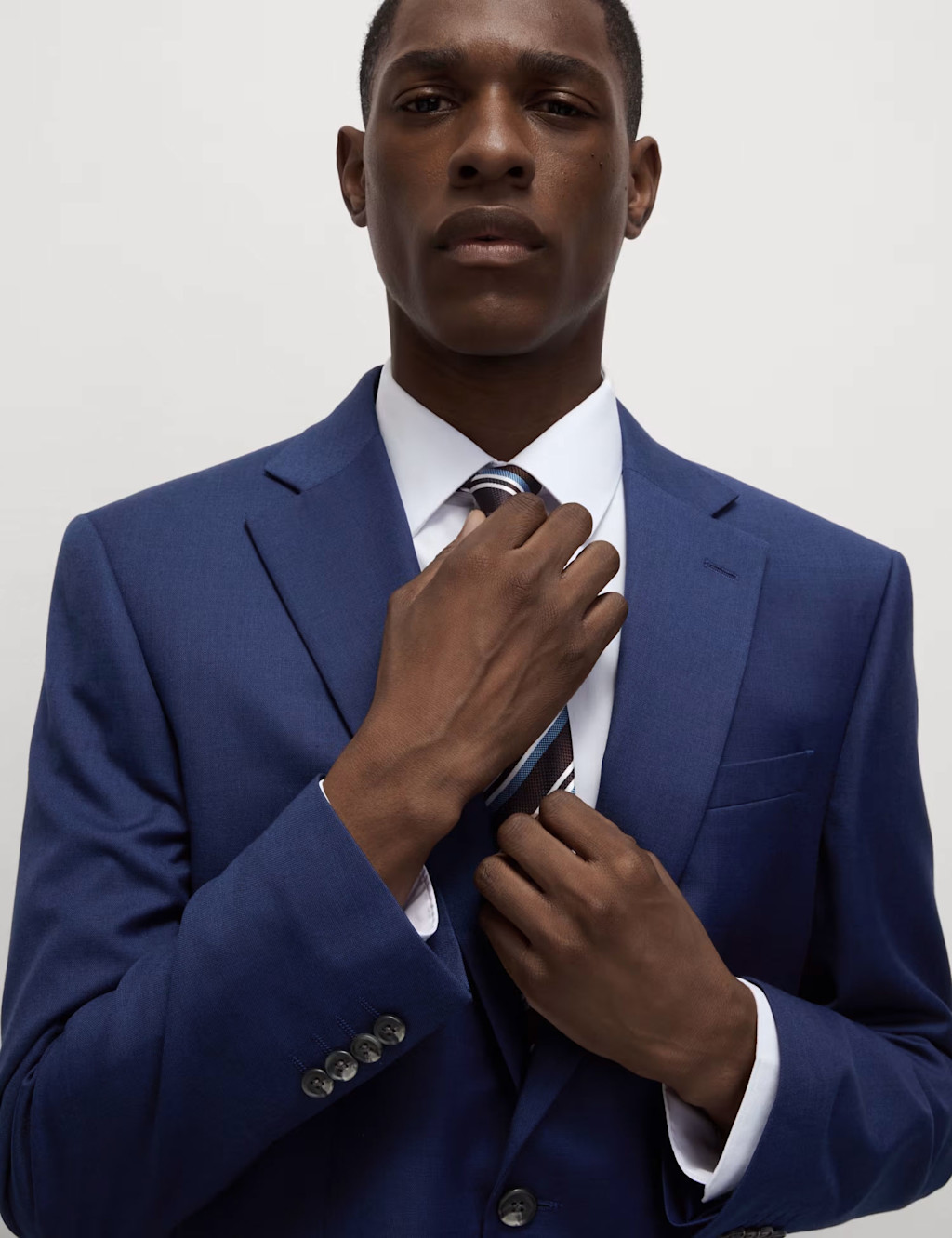 Man wearing blue suit and white shirt at M&S