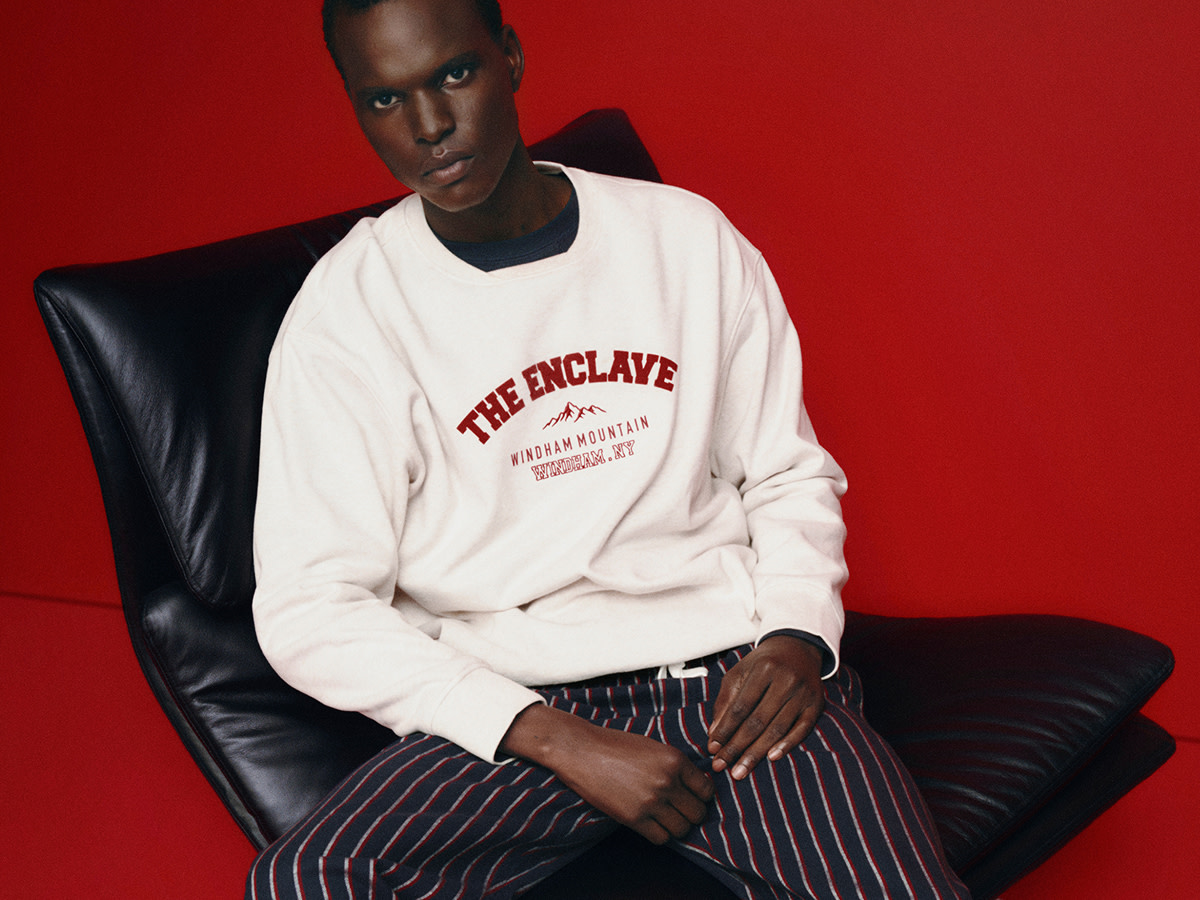 Man in white jumper and pyjama bottoms