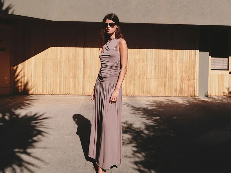 Woman wearing a brown gathered maxi dress