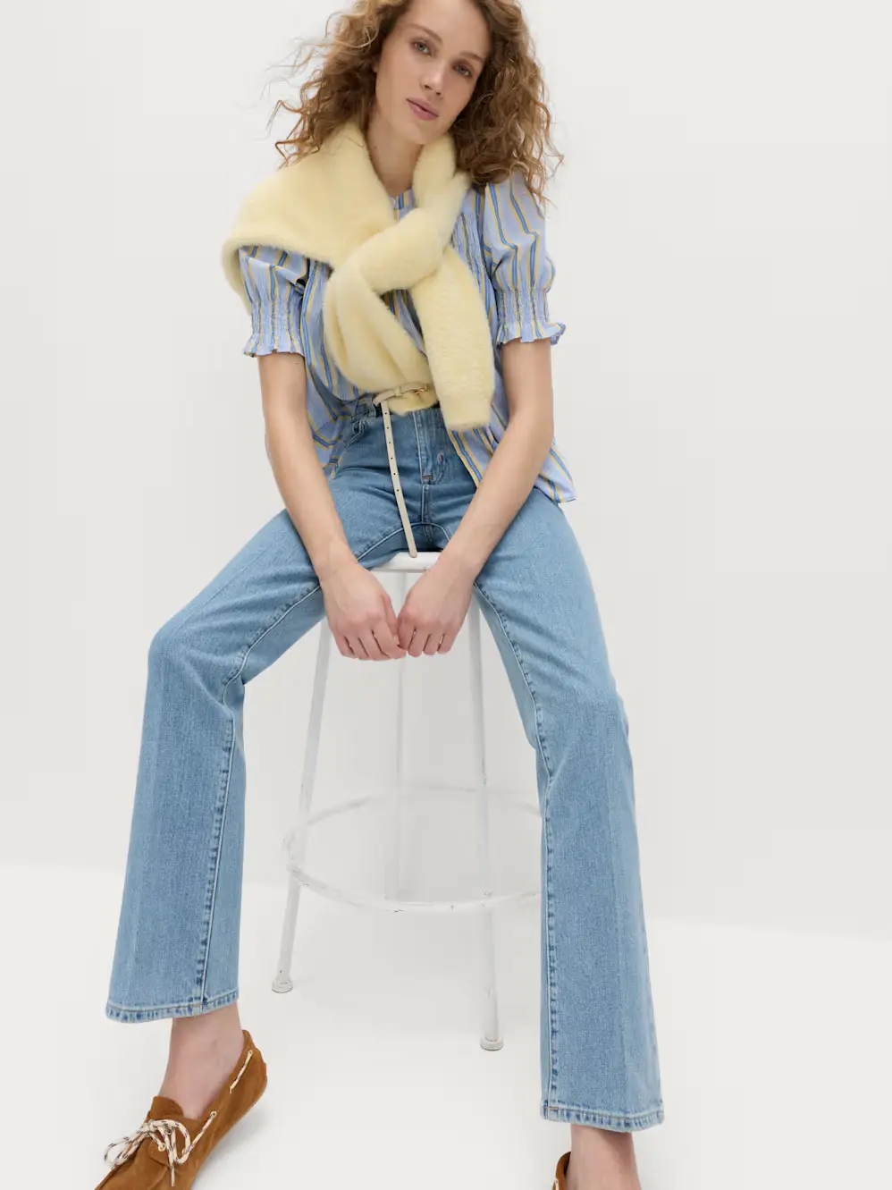 Woman in jeans and blue top