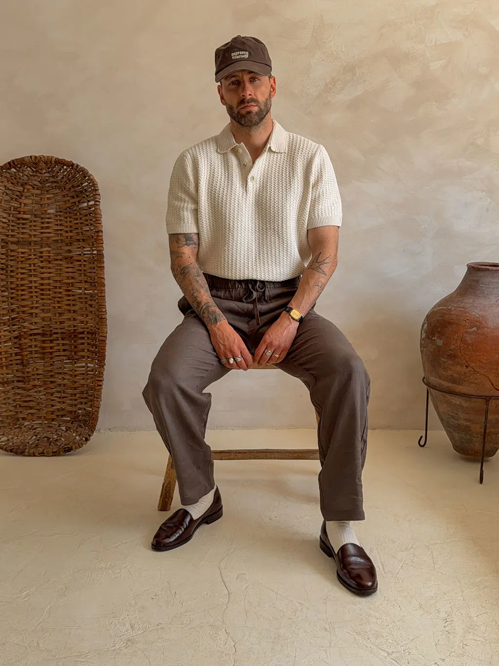 Man wearing linen trousers and knit top