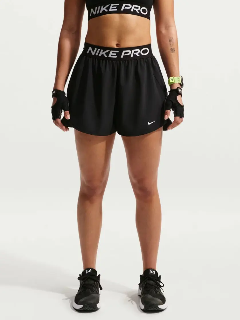 Woman wearing black sports shorts with Nike branding