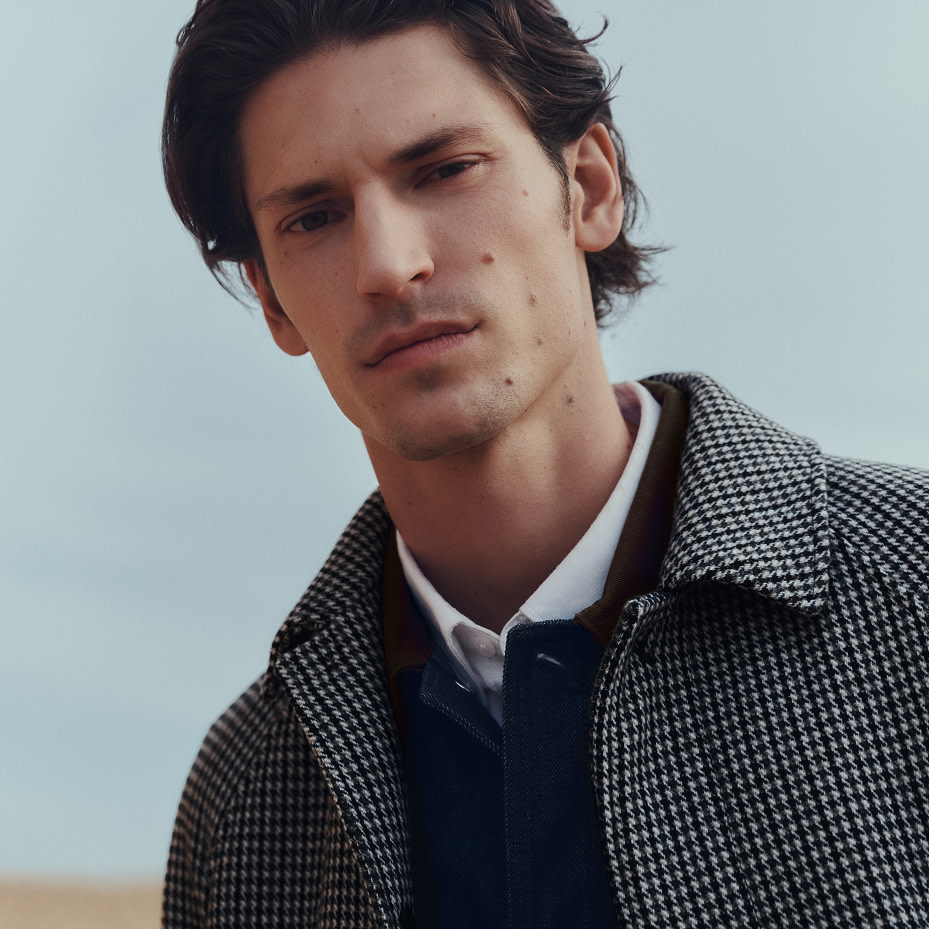 Man wearing grey coat