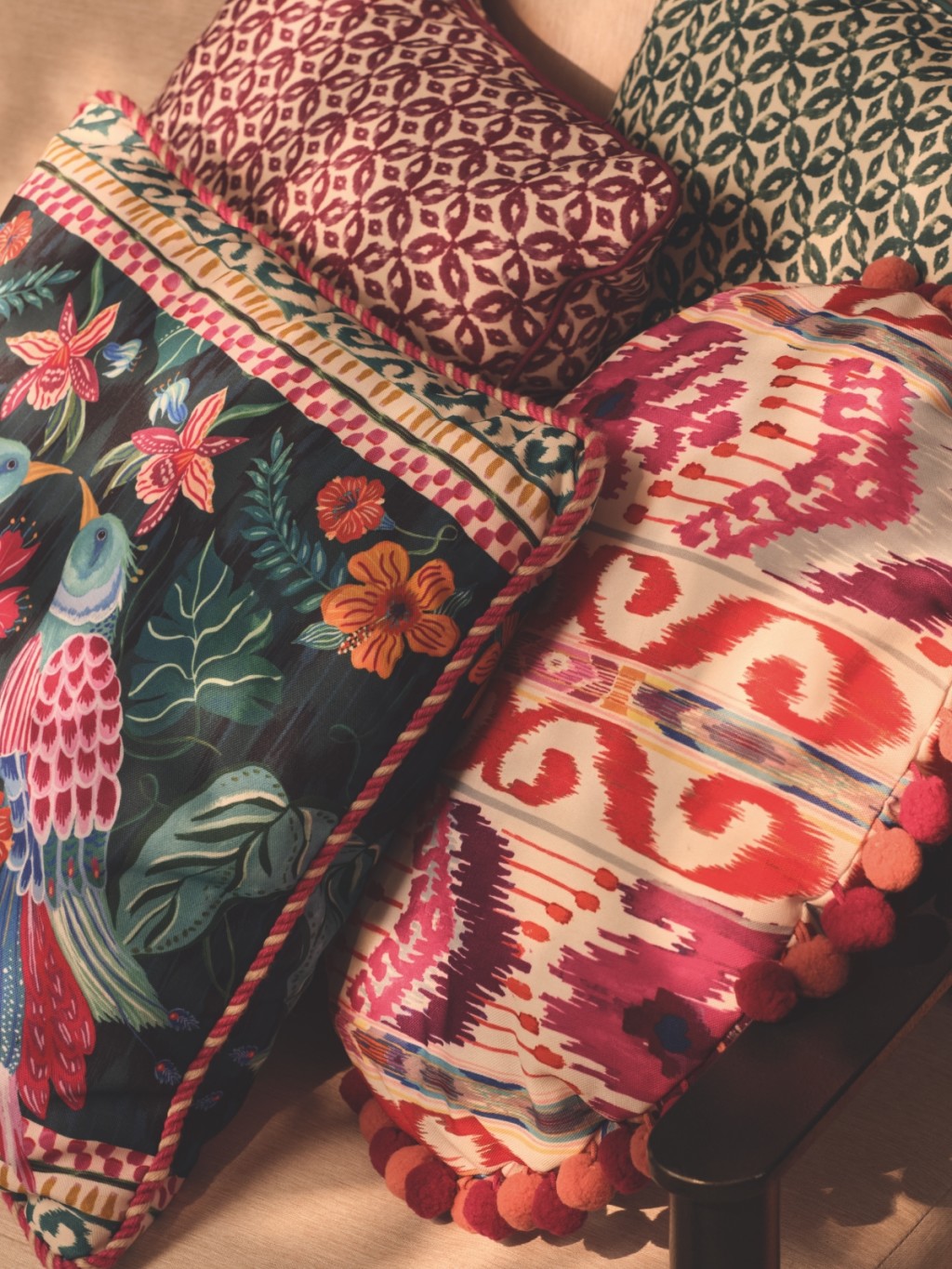 Selection of brightly coloured, patterned cushions. Shop home furnishings