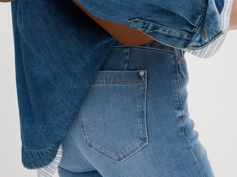 Woman wearing blue denim jeans and denim shirt