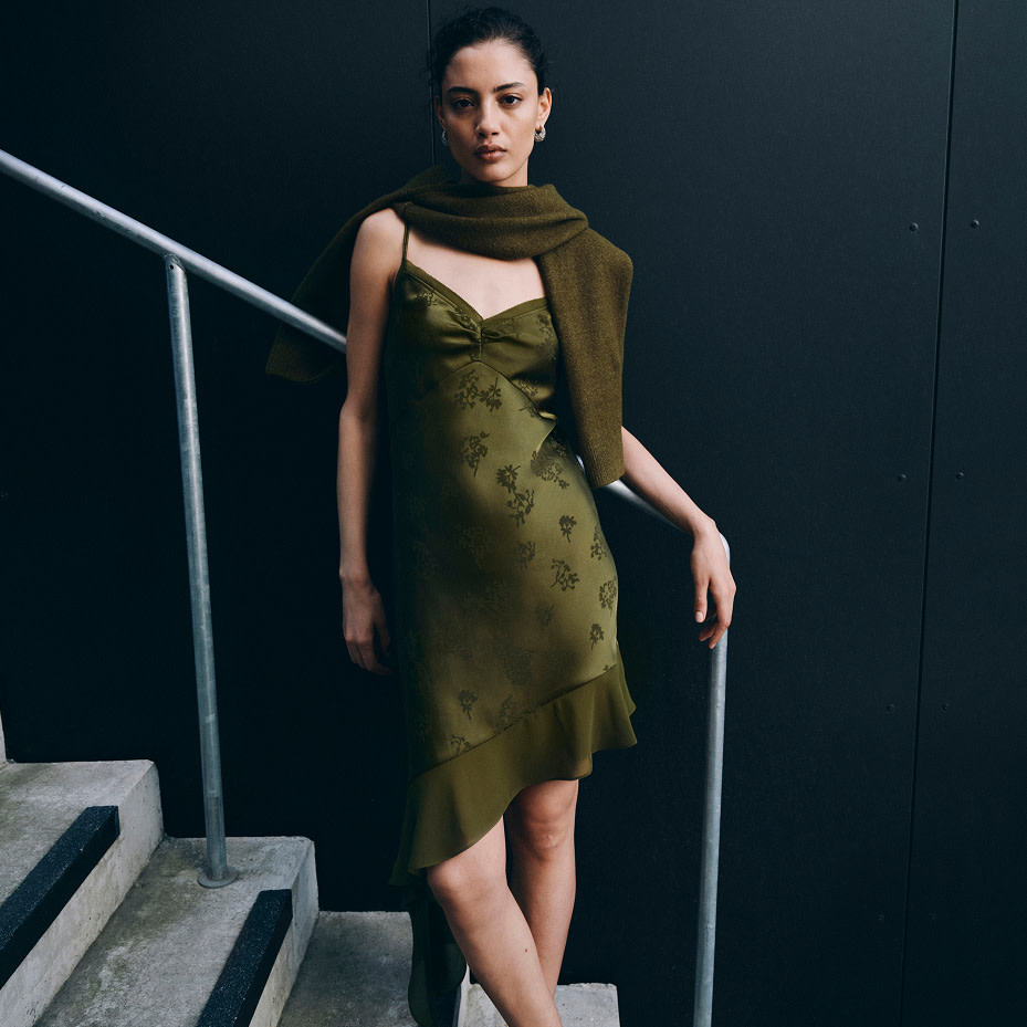 Woman wearing green slip dress