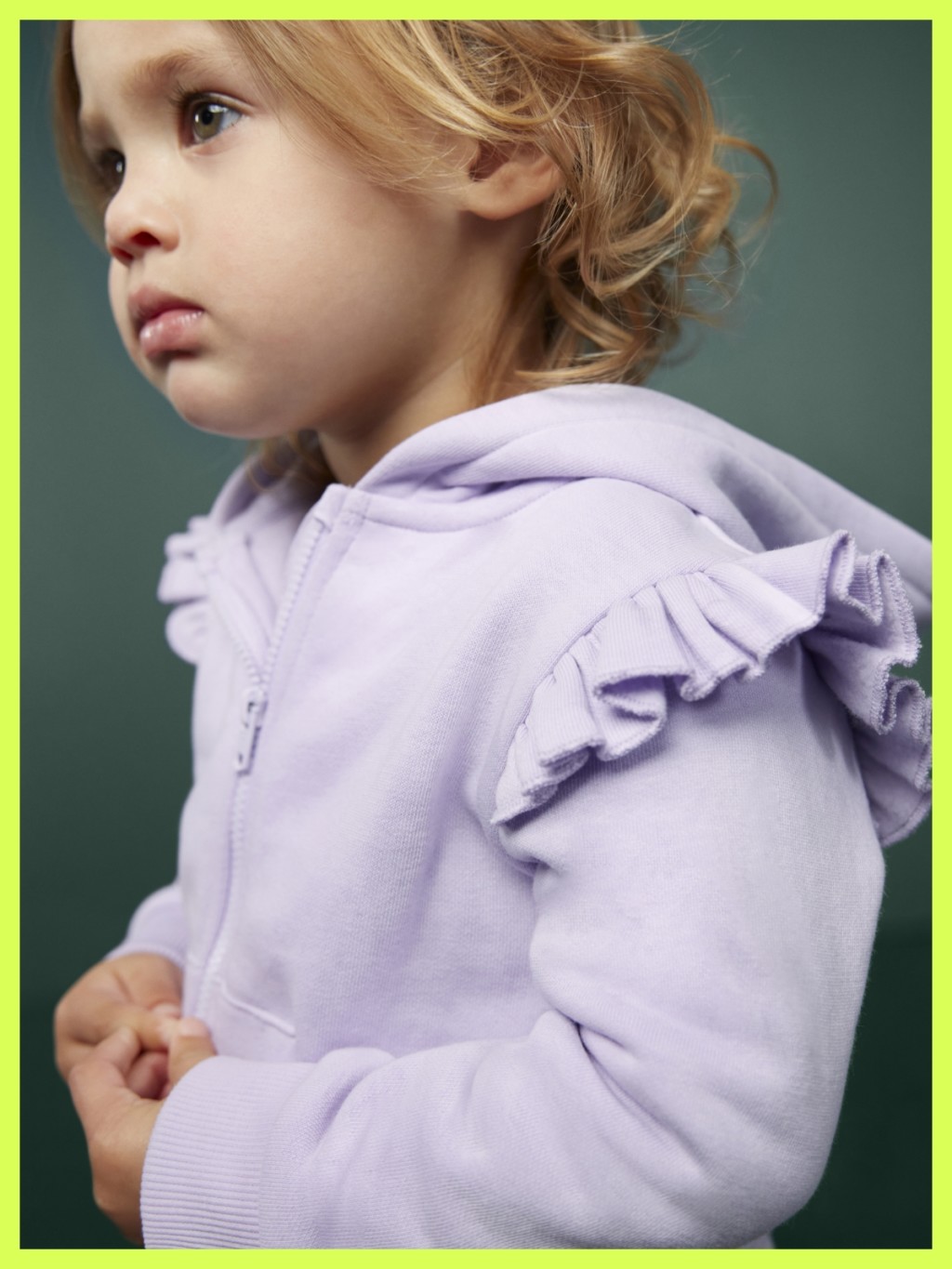 Girl wearing a lilac hoodie. Shop babywear 3 for 2