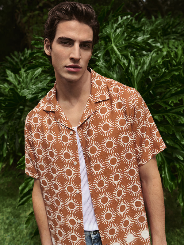 Man wearing rust coloured shirt