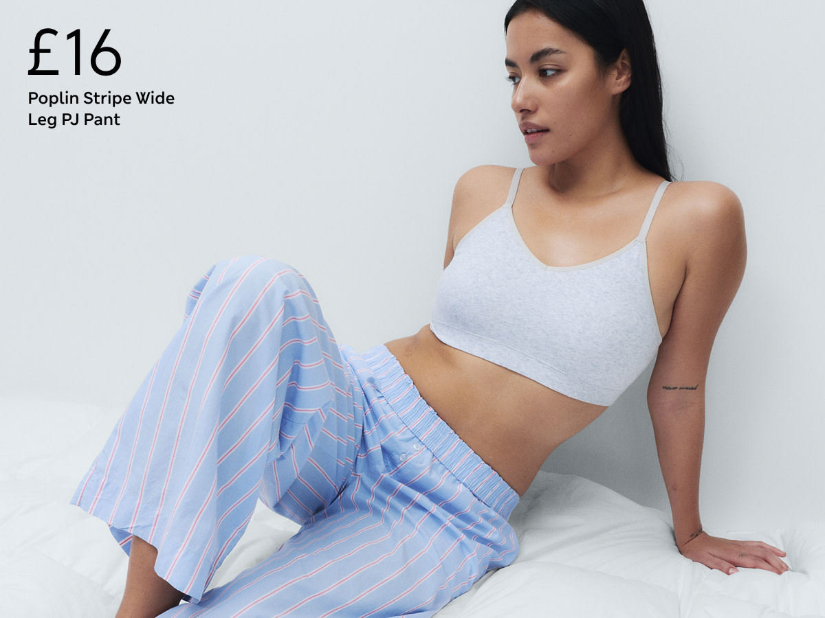 Woman wearing pyjama bottoms