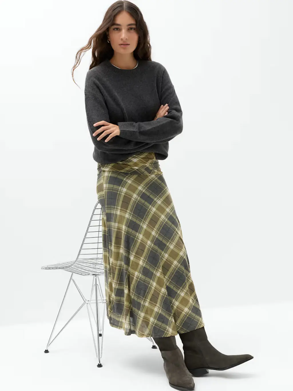 Woman in checked skirt and jumper