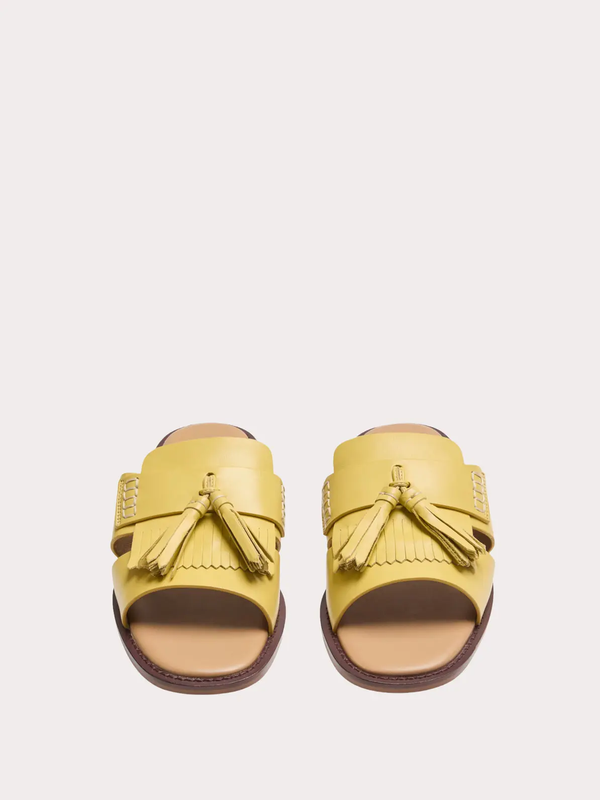 Yellow sandals with tassel details 