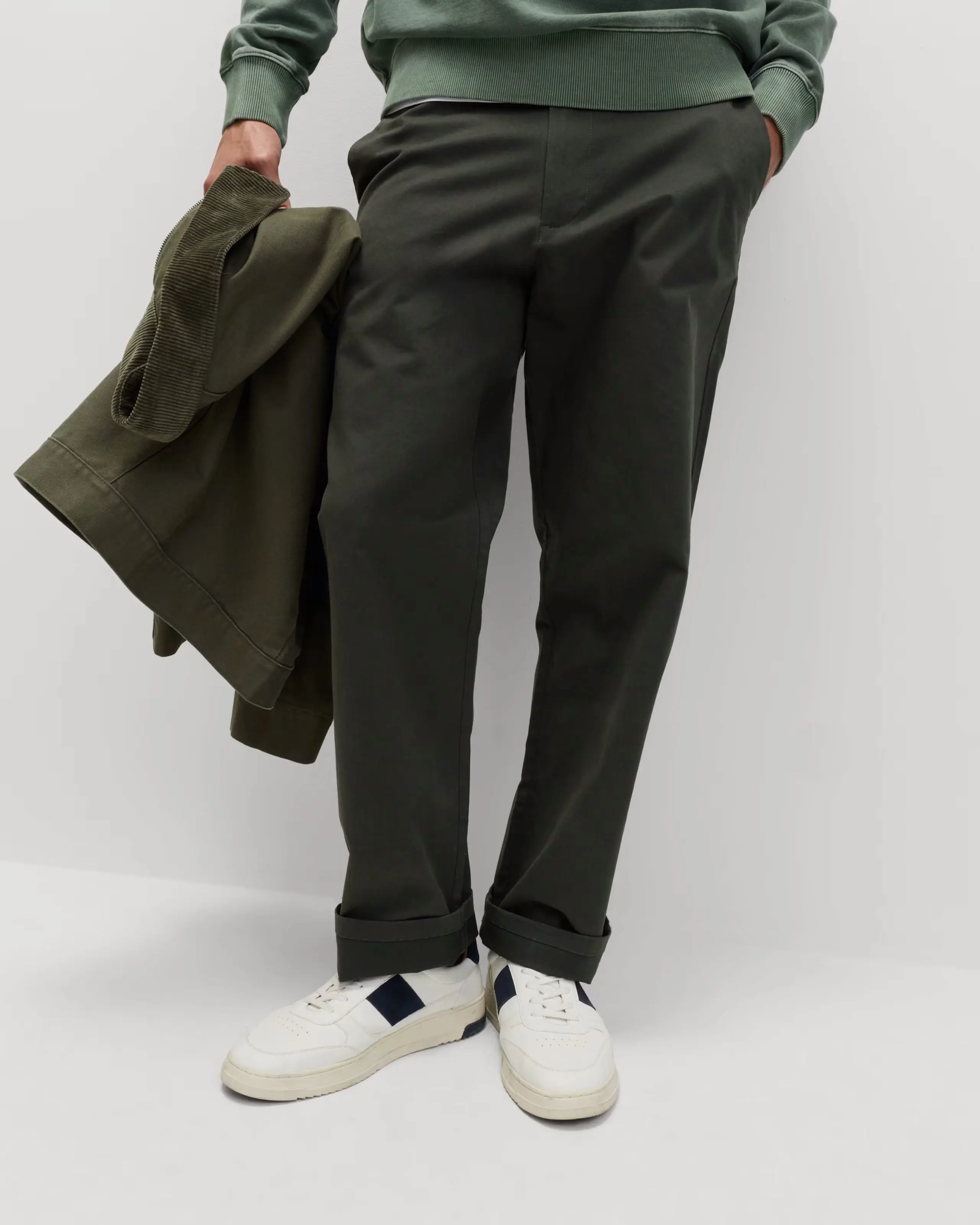 Man wearing green loose-fit chinos