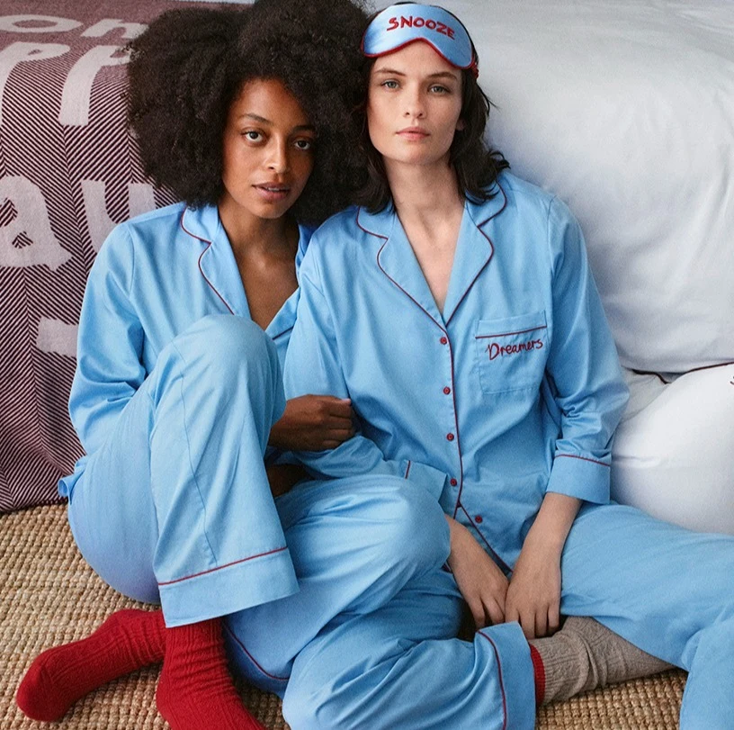 Two women wearing blue pyjamas by M&S x Bella Freud