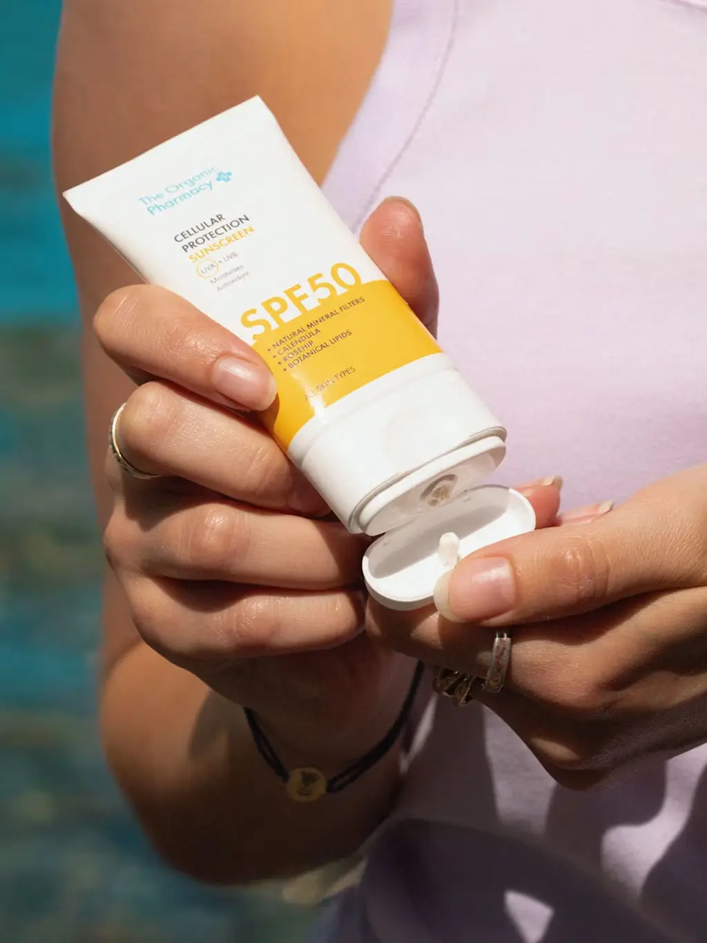 Woman applying sunscreen
