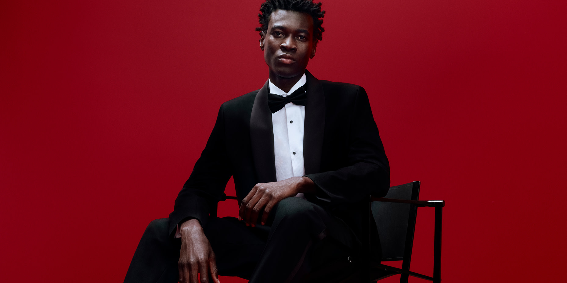 Man wearing black tuxedo suit