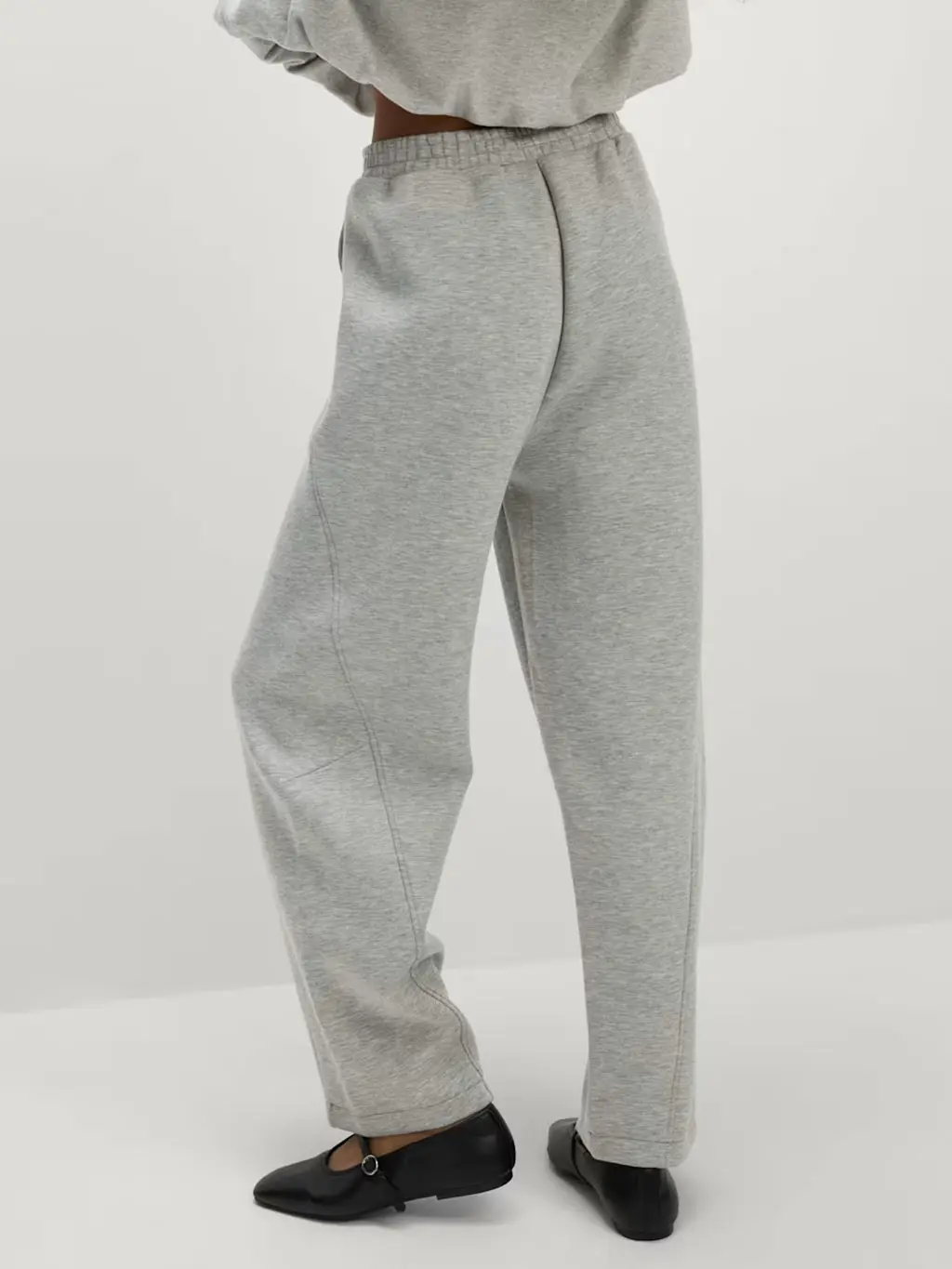 Woman wearing a grey scuba joggers