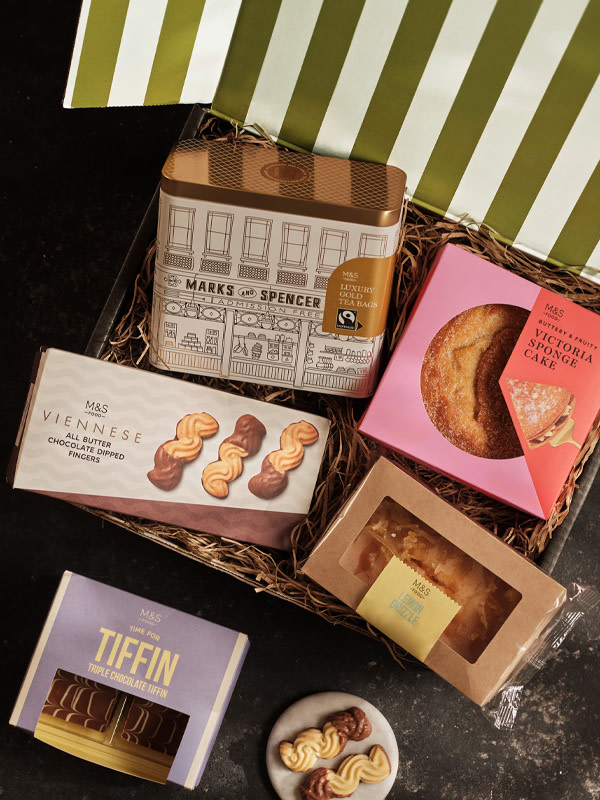 Box of tea, cakes, biscuits
