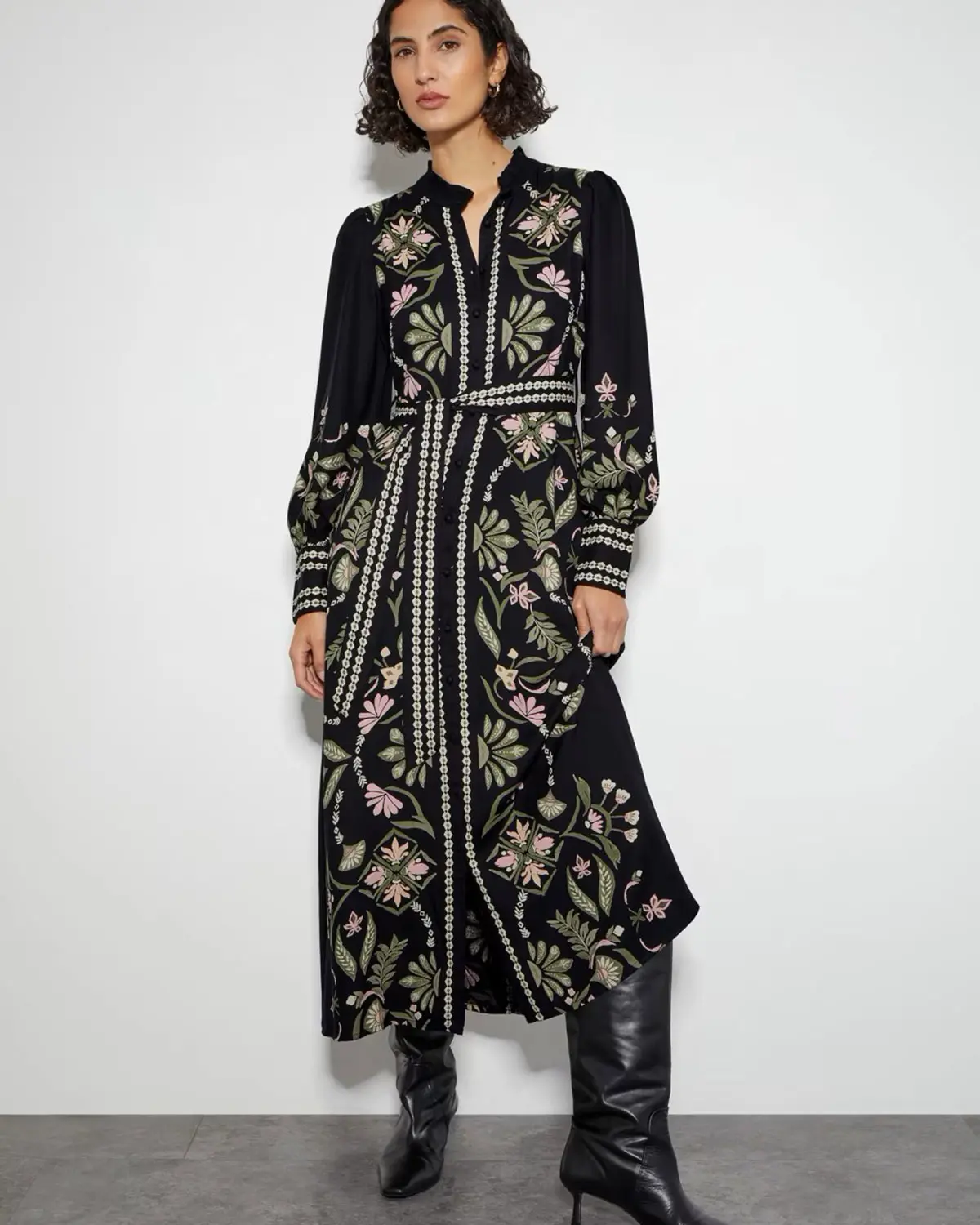 Woman wearing a floral dress by Monsoon at M&S
