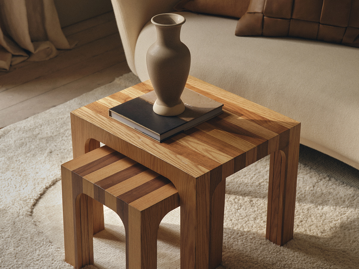 Two wooden nesting side tables