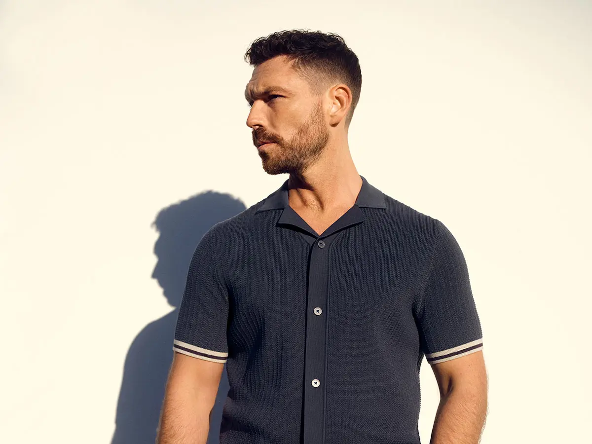 James Nelson Joyce wearing a polo shirt 