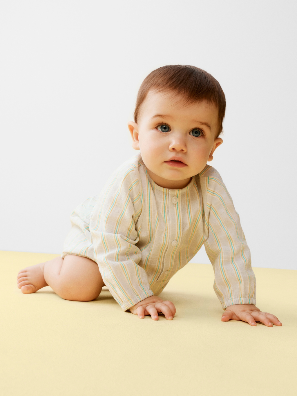 Baby wearing Christening gift babygrow