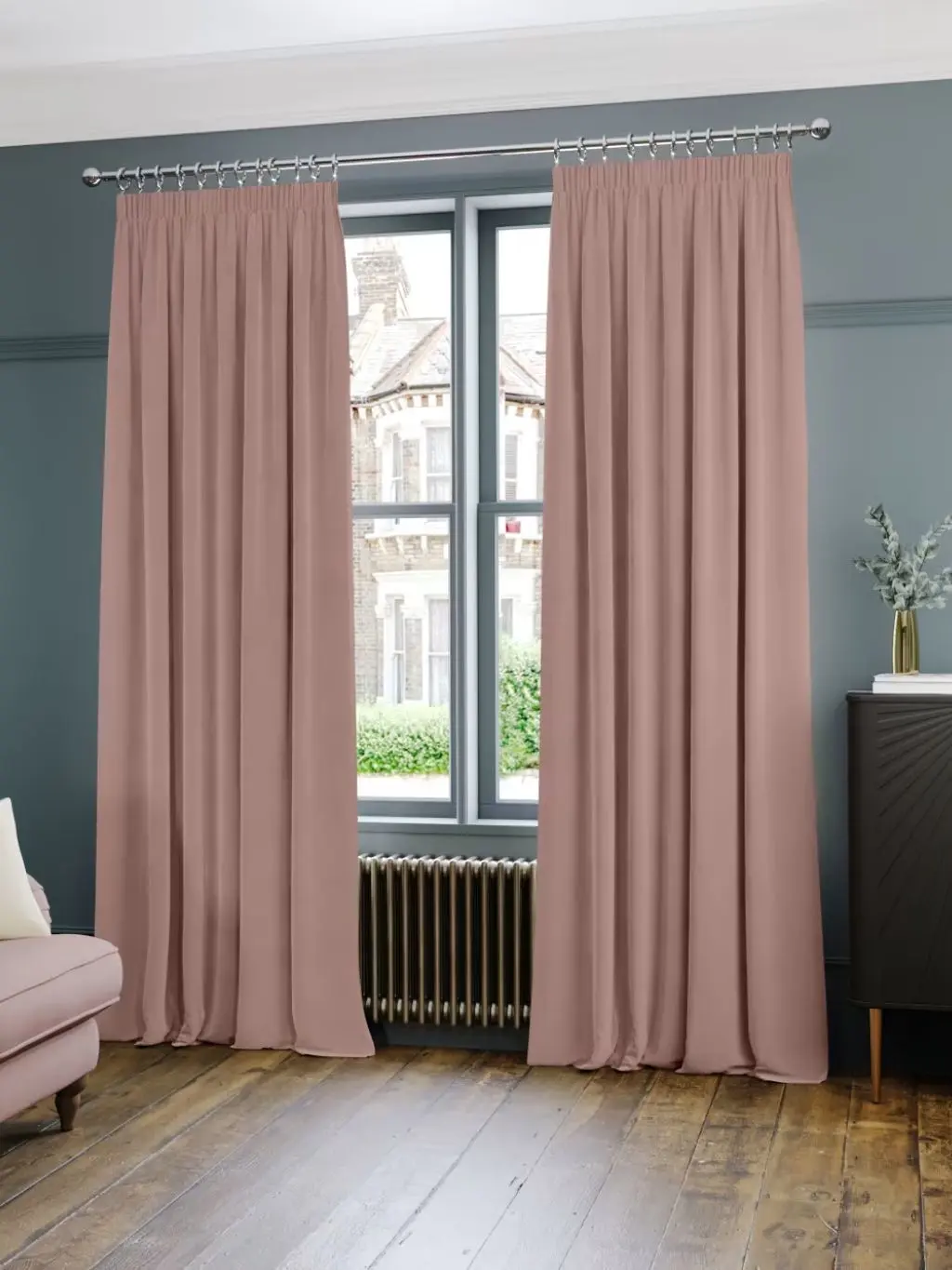A large window with opened pink velvet curtains
