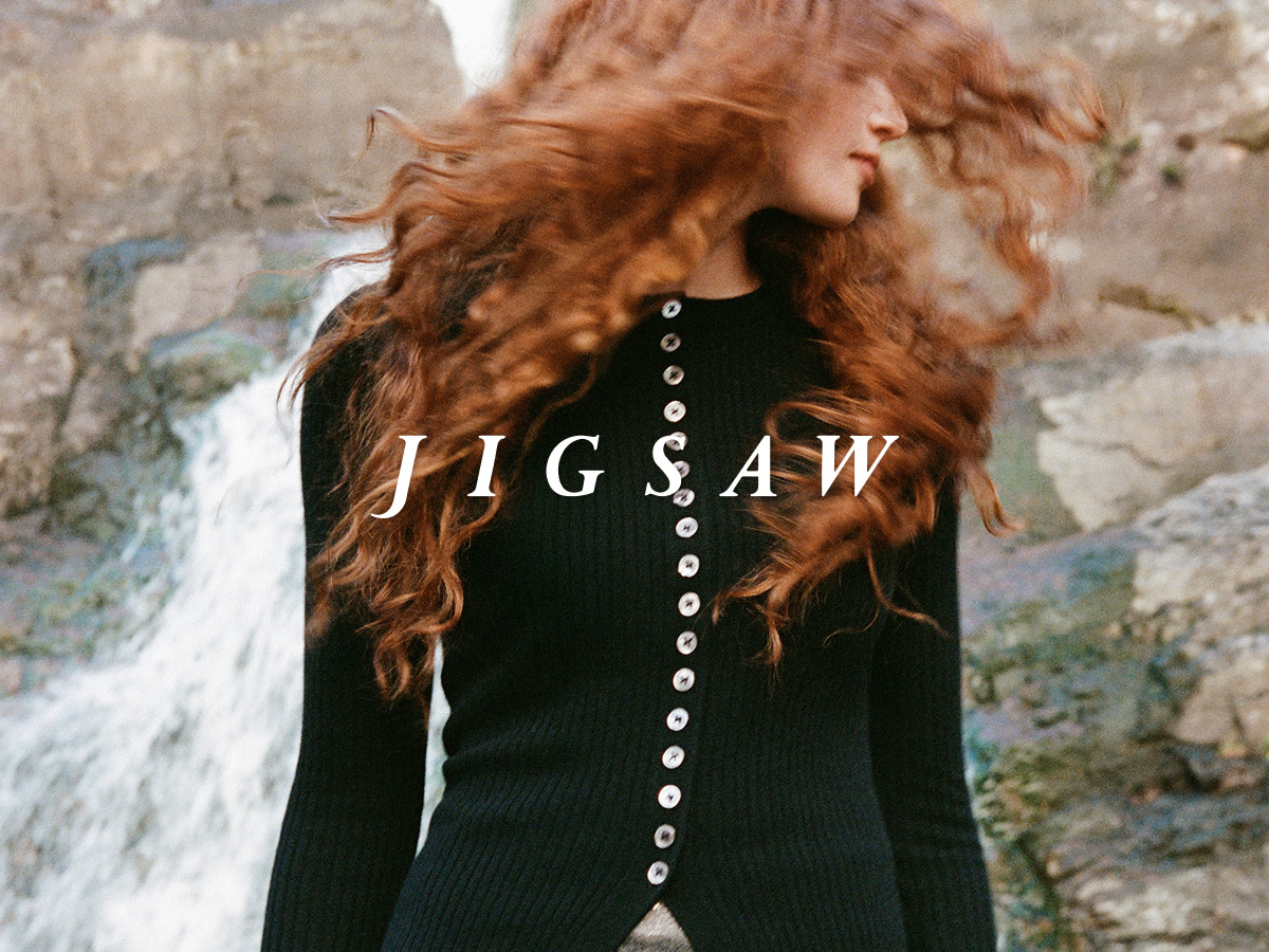 Women wearing black Jigsaw cardigan