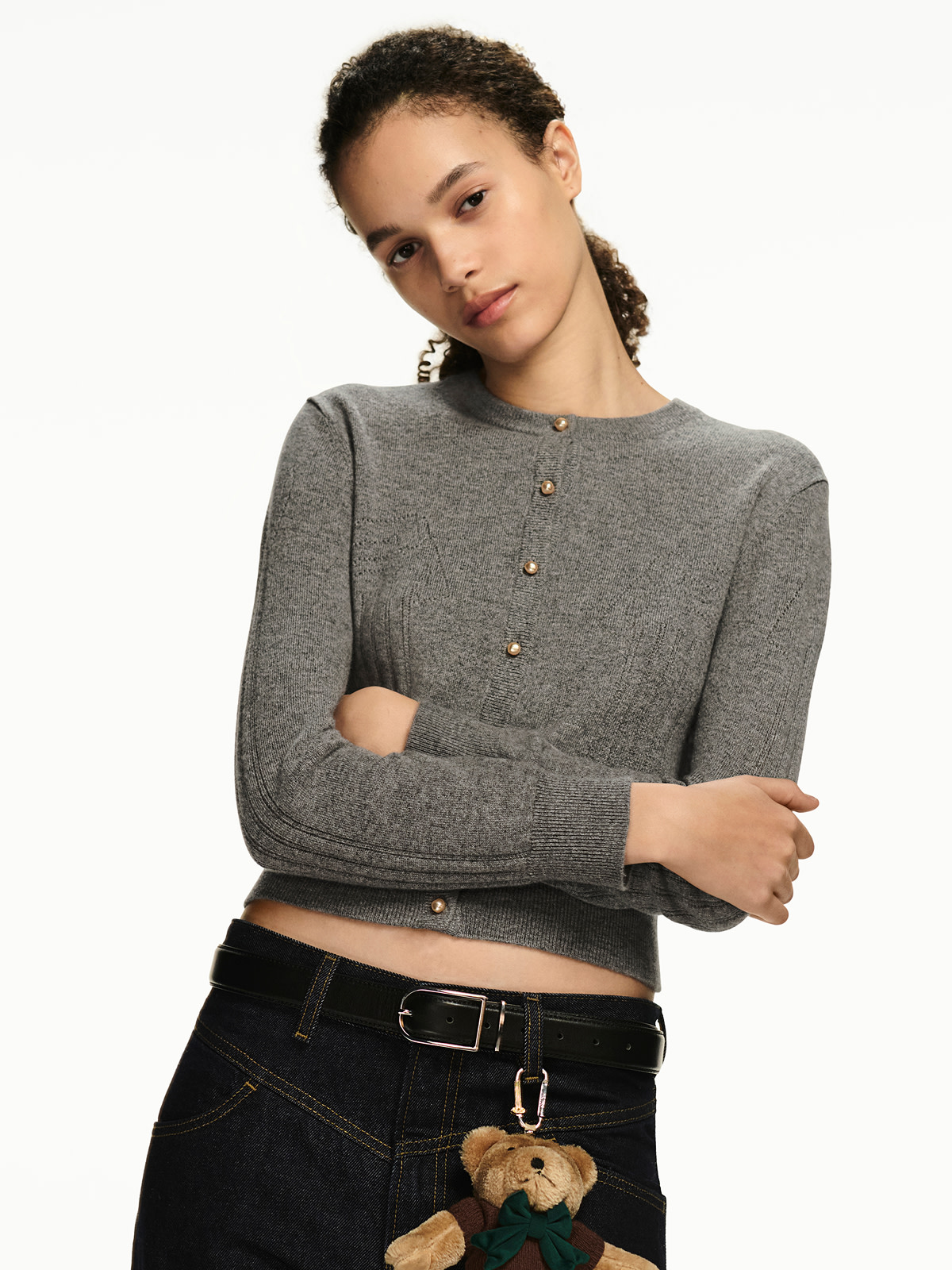 Woman wearing grey cropped cardigan