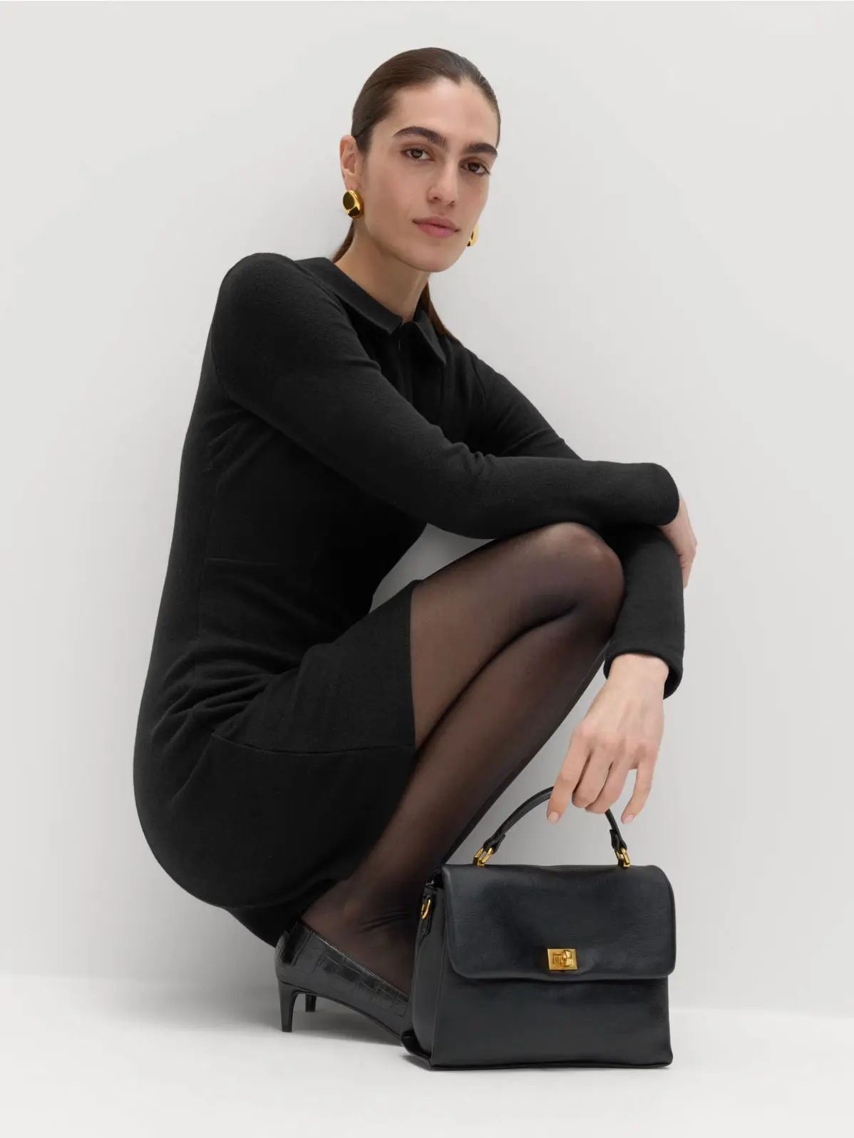 Woman wearing a mini-length black dress