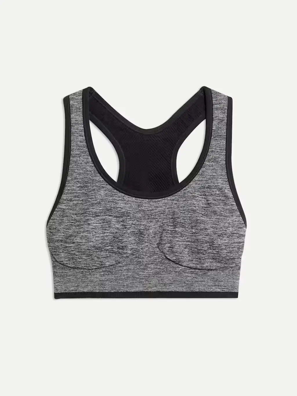 A cutout of a black and white seamless running bra