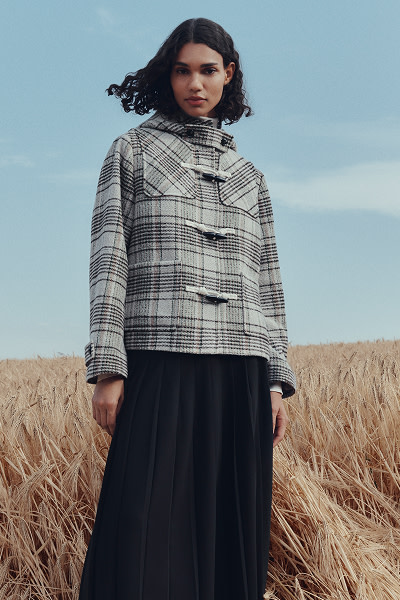Woman wearing checked coat
