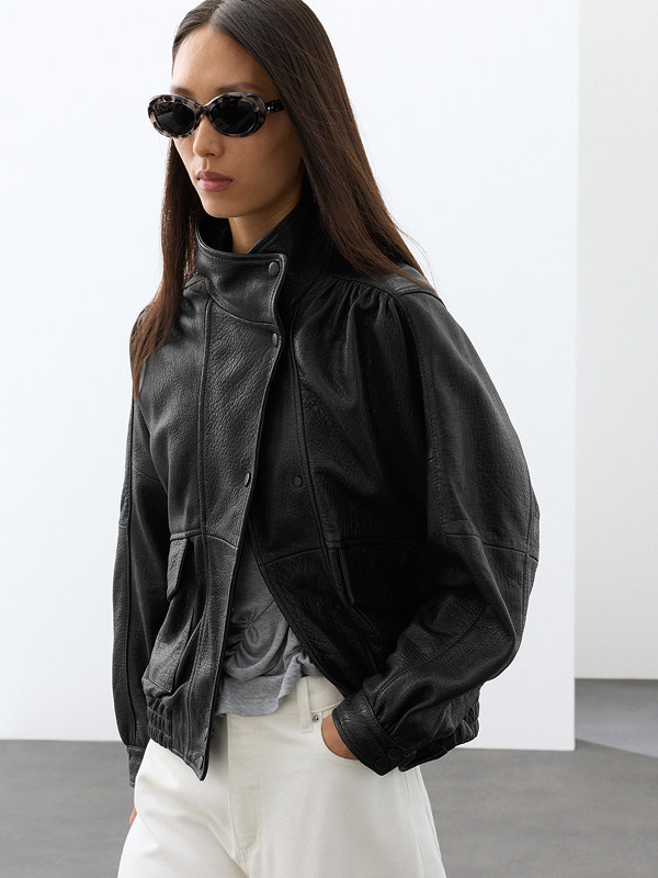 Woman wearing leather jacket