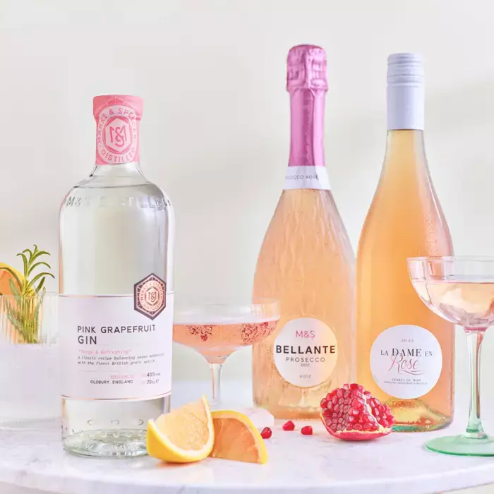 Selection of pink gin, prosecco and rose bottles. Shop wine offers