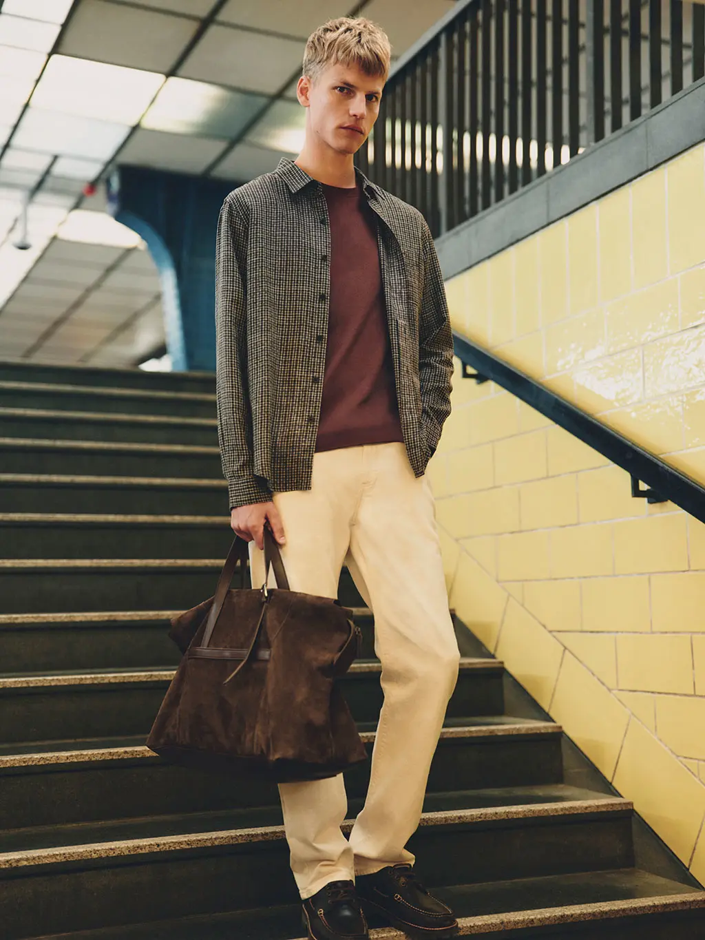 Man in checked overshirt and khakis
