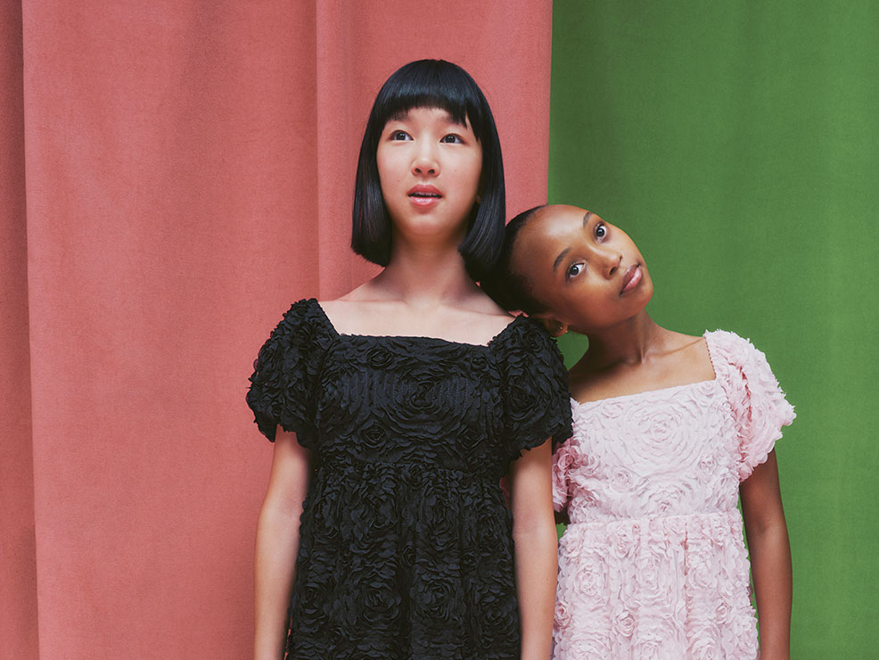 Two girls wearing lace dresses from the Wicked range at M&S