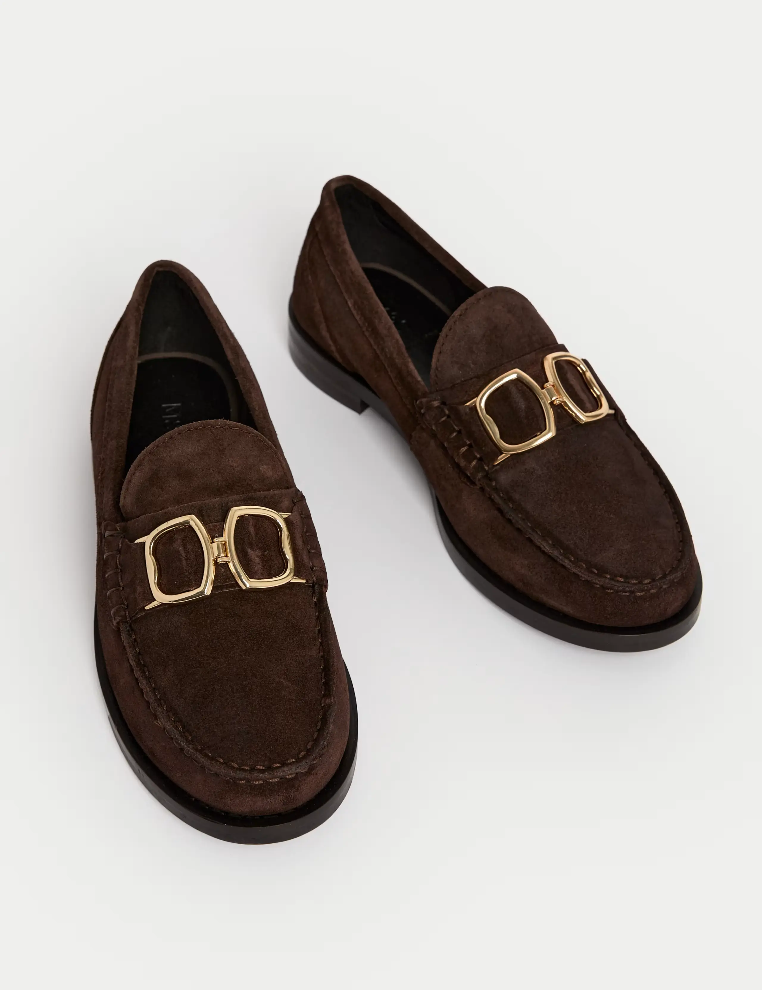 A pair of brown suede loafers