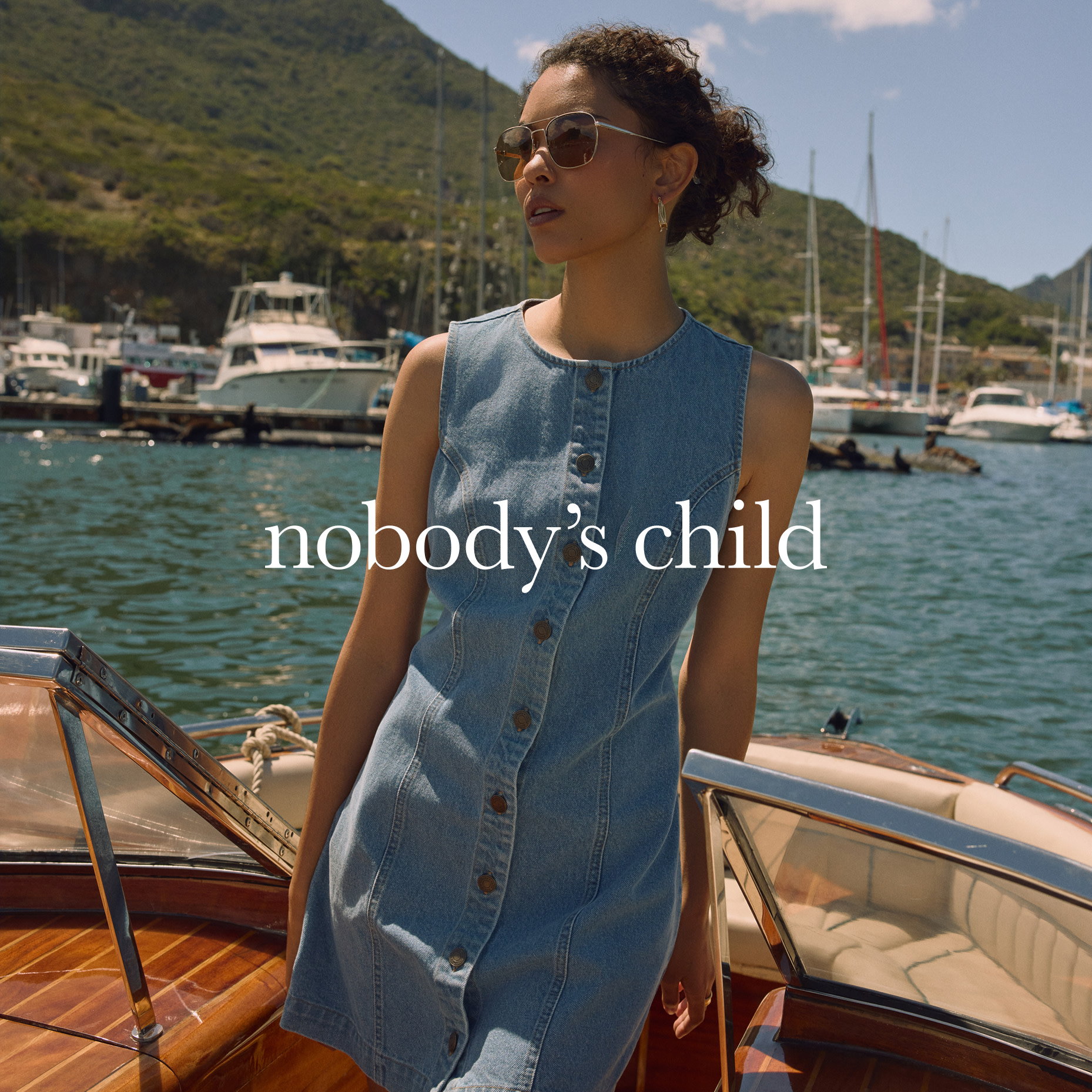 Woman wearing Nobody's Child denim dress