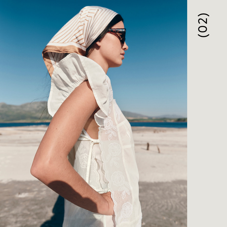 Woman in white top and bandana