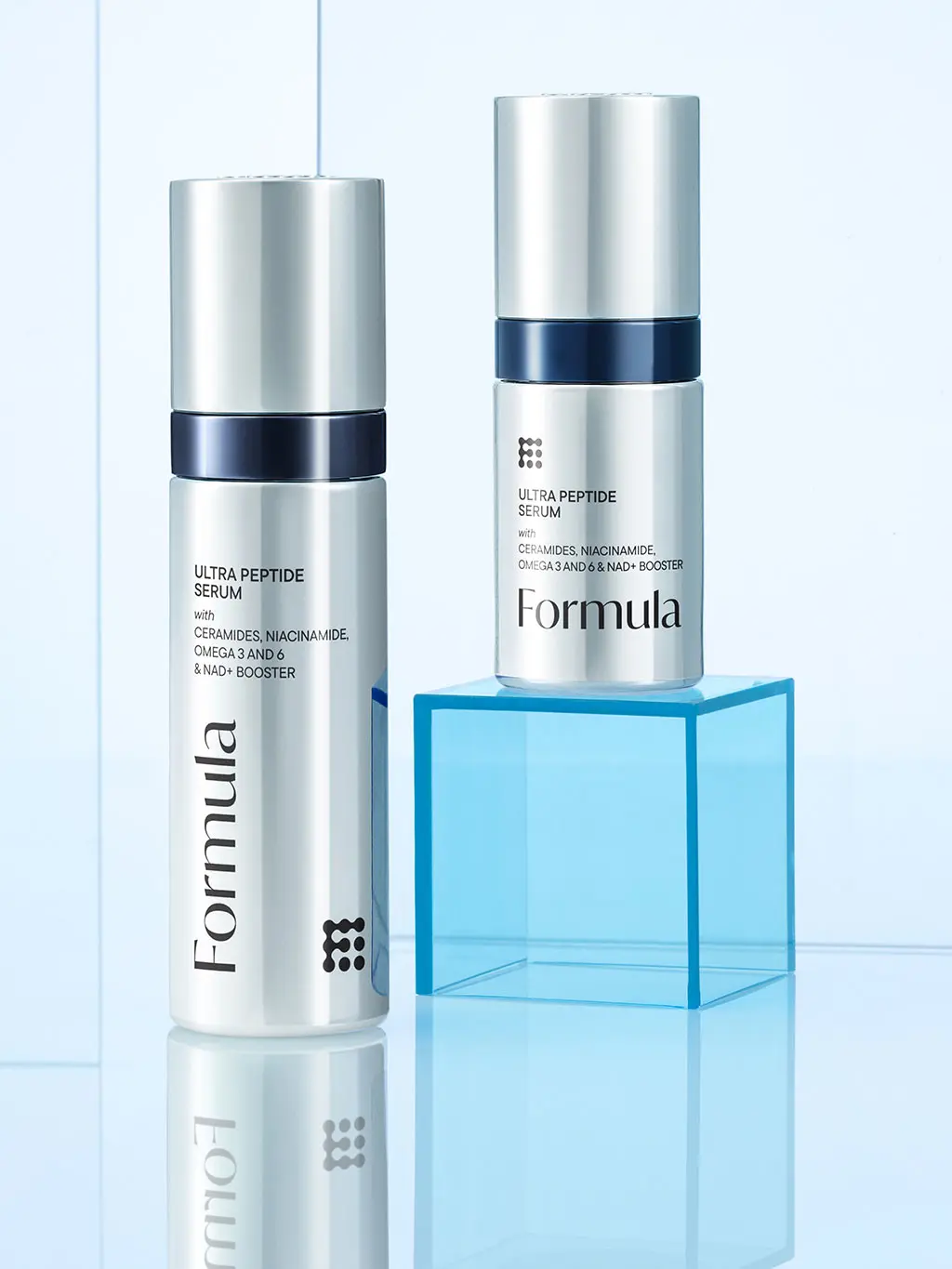 Close up of two Formula skincare products