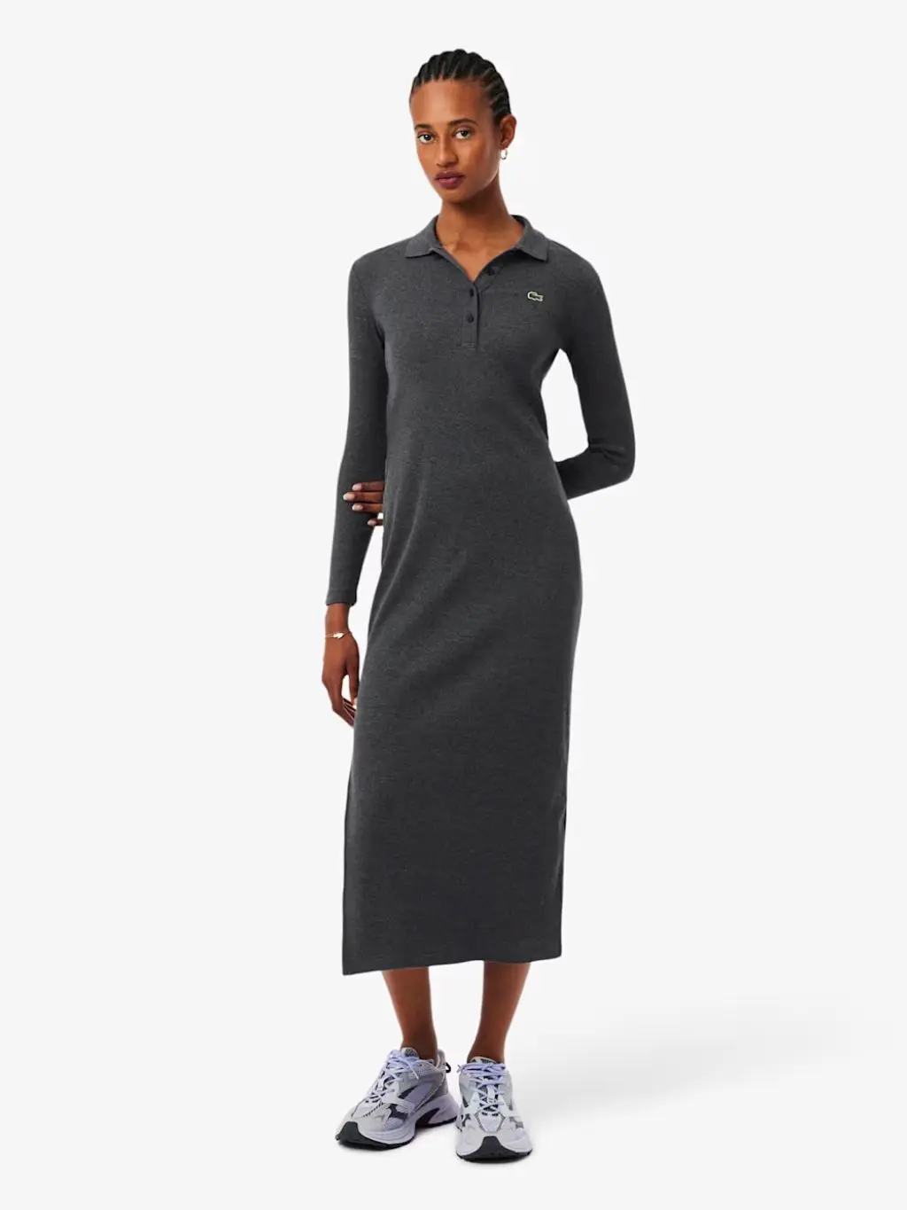 Woman wearing floral midi smock dress and white trainers 