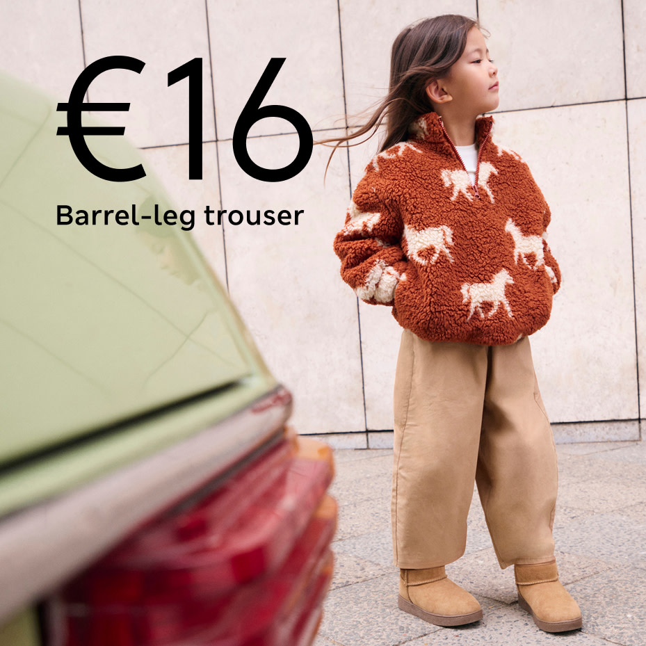 Girl in sweatshirt and trousers