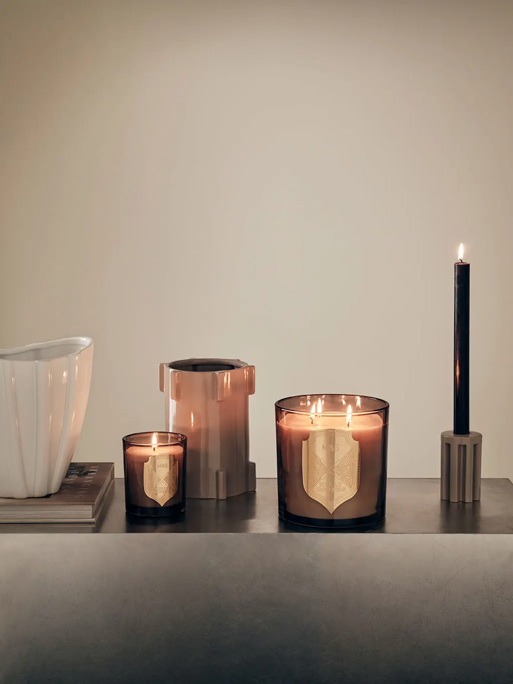 Kelly Hoppen candles on grey table