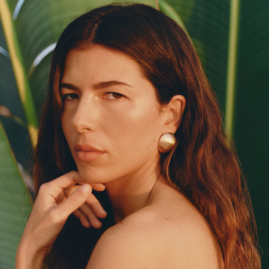 Woman wearing gold earrings