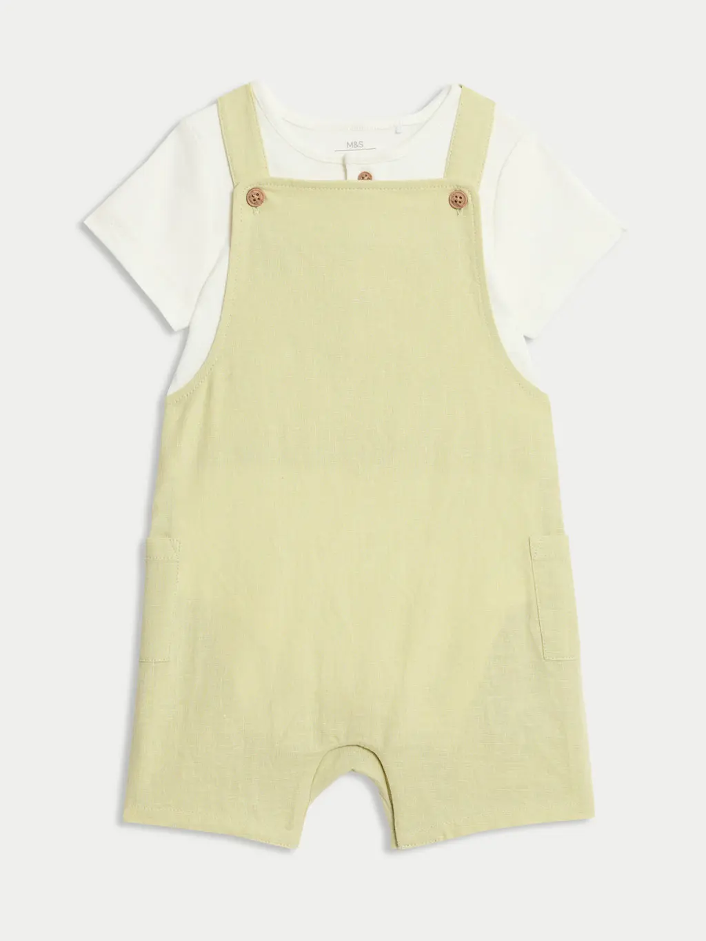A green dungaree set for infants aged 0-3 years
