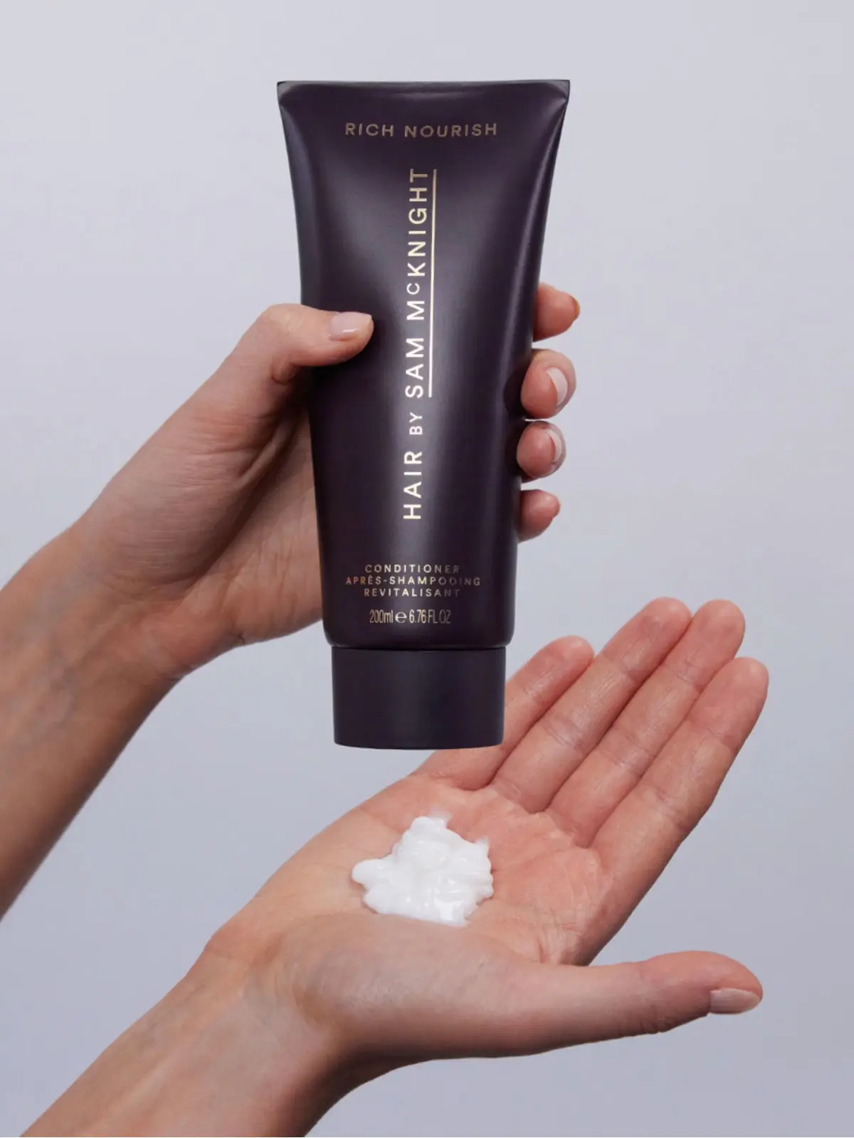 Woman using conditioner 