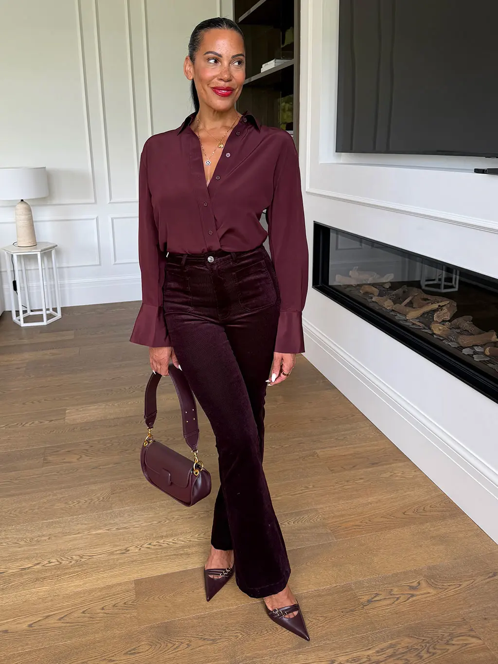 Karen Williams in burgundy workwear outfit
