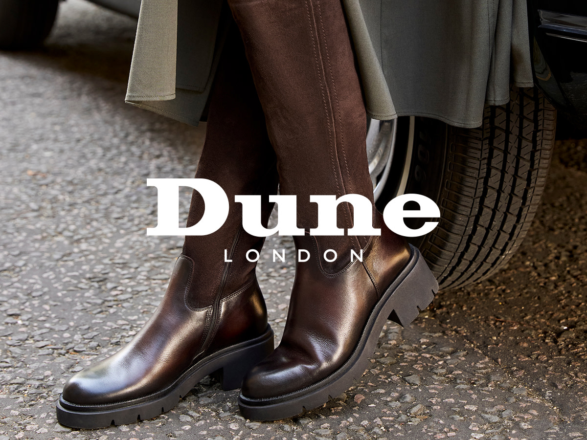 Woman wearing Dune brown knee-high boots