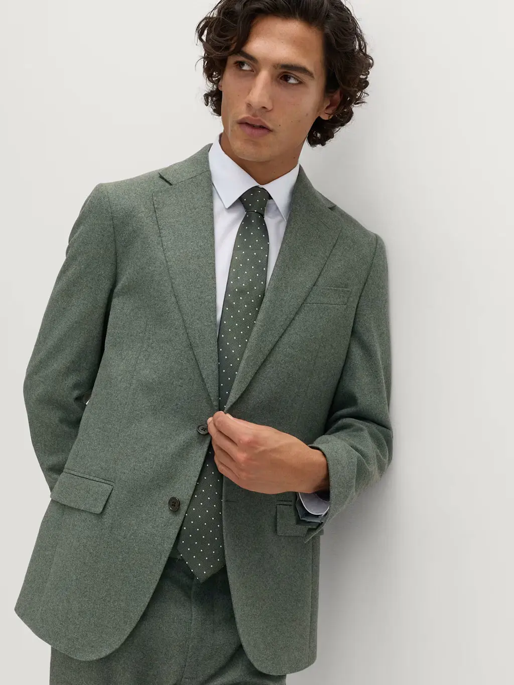 Man in green tweed suit